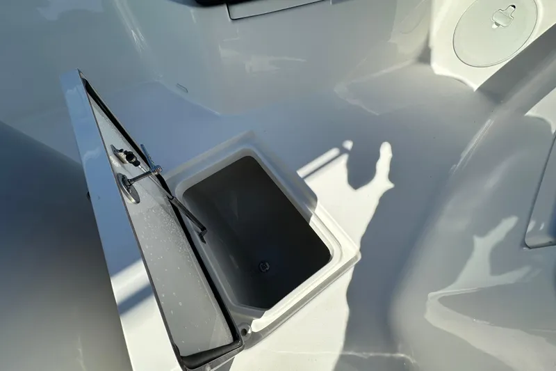 Slide: The Image of Open storage compartment on 2026 Sea Pro 292 Offshore boat deck. - 11