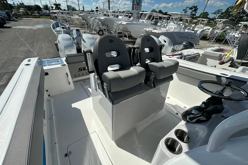 Slide: The Image of 2026 Sea Pro 292 Offshore boat interior with dual seats and steering wheel. - 13