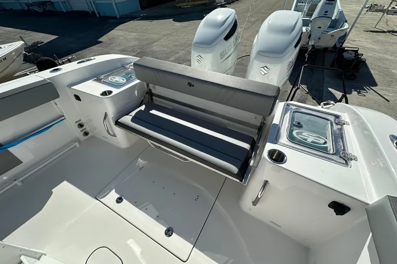 Slide: The Image of 2026 Sea Pro 292 Offshore boat interior with seating and dual outboard engines. - 18