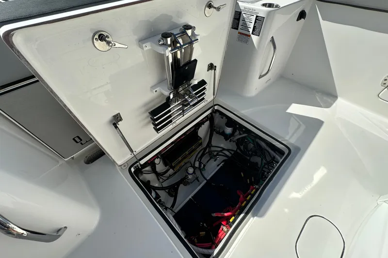 Slide: The Image of 2026 Sea Pro 292 Offshore boat showing open hatch with internal wiring and components. - 21
