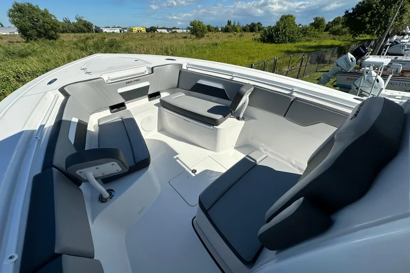 Slide: The Image of 2026 Sea Pro 292 Offshore boat interior with gray seating and open deck. - 7