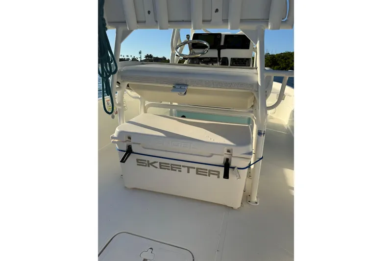 Slide: The Image of 2017 Skeeter SX230 boat interior with Engel cooler and steering console. - 24