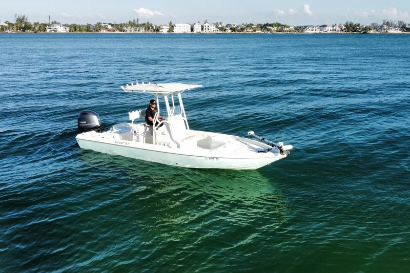 Slide: The Image of Aerial view of 2017 Skeeter SX230 boat on green water. - 4