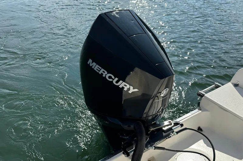 Slide: The Image of Mercury outboard motor on 2022 Sailfish 242 CC boat in water. - 5