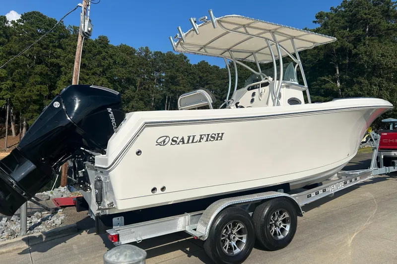 Slide: The Image of 2022 Sailfish 242 CC boat on trailer, featuring a Mercury outboard motor. - 17