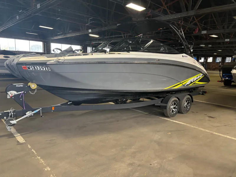 The Image of 2020 Yamaha AR240 boat on trailer in indoor storage facility. - 0