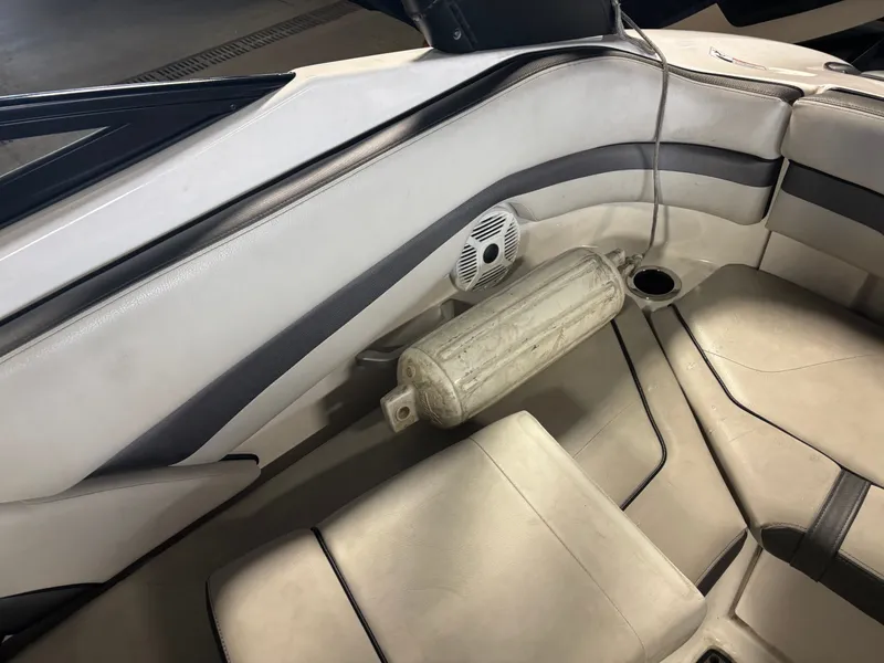 Slide: The Image of 2020 Yamaha AR240 boat interior with beige seating and speaker. - 13