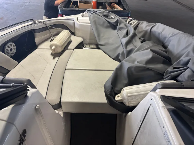 Slide: The Image of 2020 Yamaha AR240 boat interior with seating and protective cover. - 6