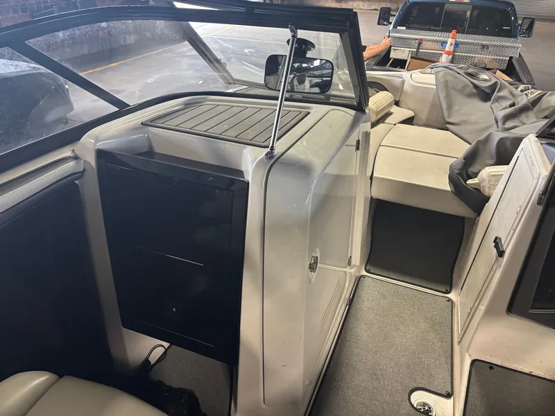 Slide: The Image of 2020 Yamaha AR240 boat interior with seating and storage compartments. - 7