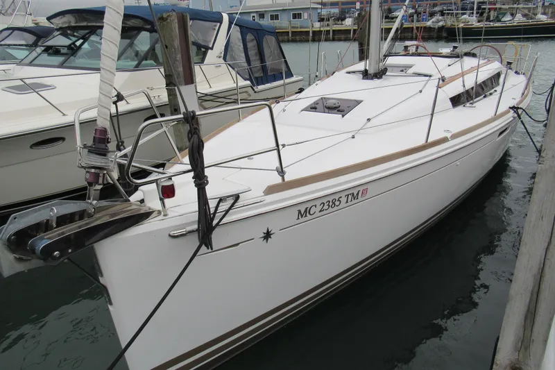 The Image of 2013 Jenneau Sun Odyssey 379 sailboat docked in marina. - 0