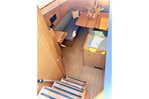 Slide: The Image of 2013 Jenneau Sun Odyssey 379 interior with seating, table, and stairs. - 18