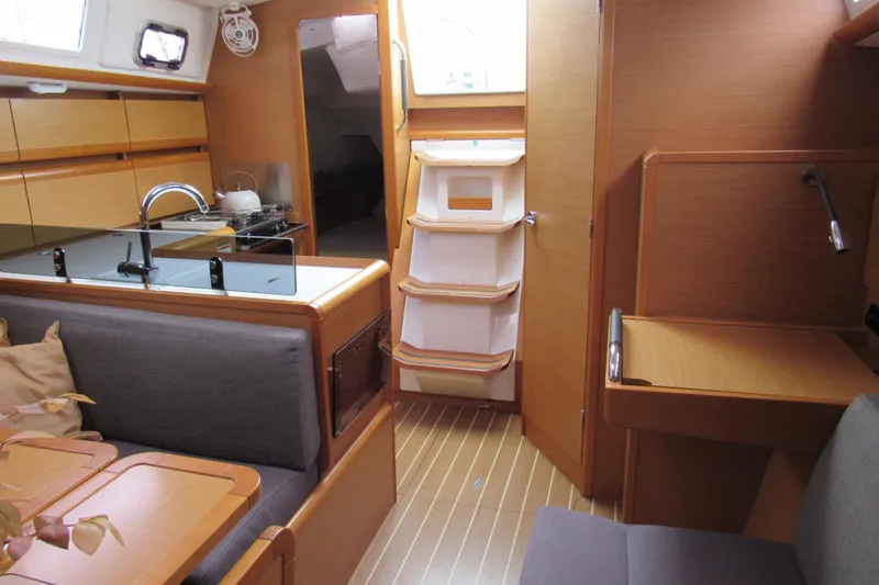 Slide: The Image of Interior of 2013 Jenneau Sun Odyssey 379 yacht with modern kitchen and seating area. - 25