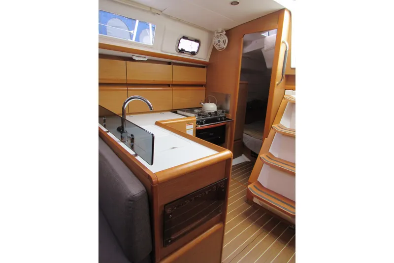 Slide: The Image of Interior of 2013 Jenneau Sun Odyssey 379 yacht, featuring modern kitchen and cozy cabin. - 26