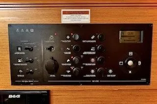 Slide: The Image of Control panel of 2013 Jenneau Sun Odyssey 379 sailboat with various switches and display. - 39