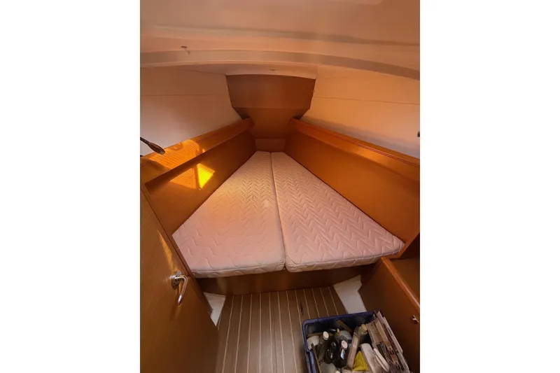 Slide: The Image of 2013 Jenneau Sun Odyssey 379 cabin interior with mattress and wooden finish. - 40