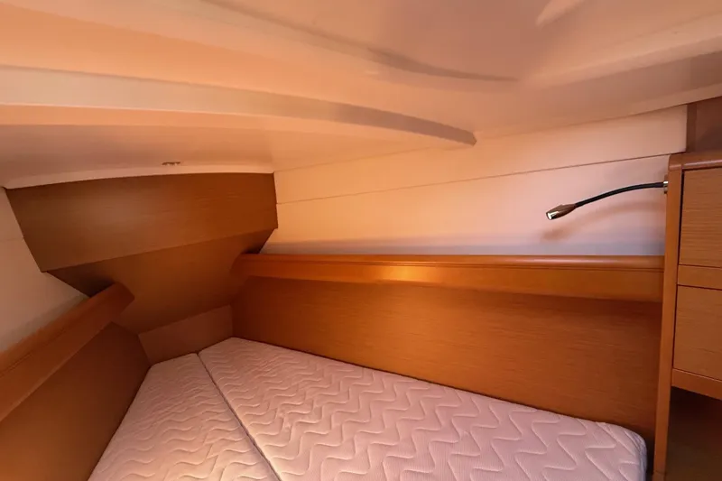 Slide: The Image of Interior cabin of 2013 Jenneau Sun Odyssey 379 sailboat with cozy bed and reading light. - 41