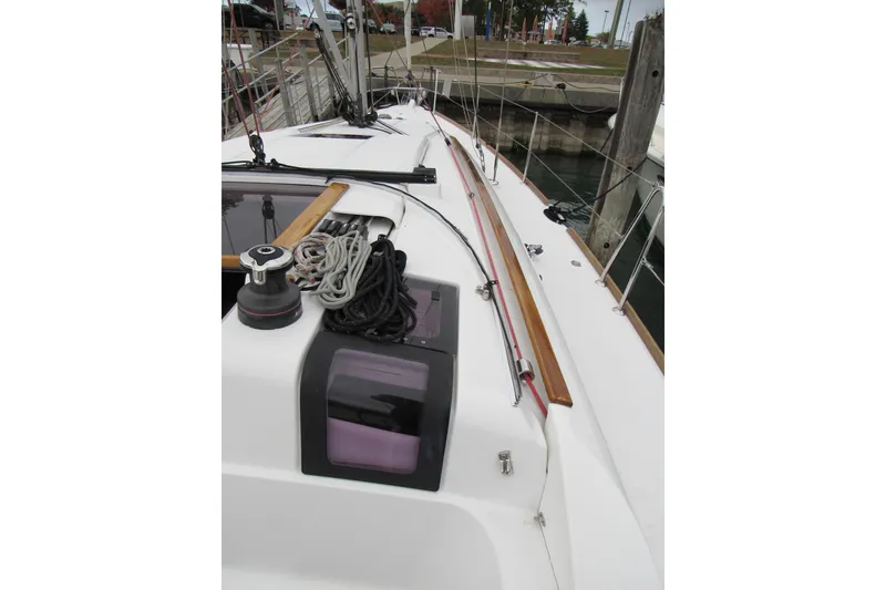 Slide: The Image of 2013 Jenneau Sun Odyssey 379 sailboat deck with ropes and winch. - 5