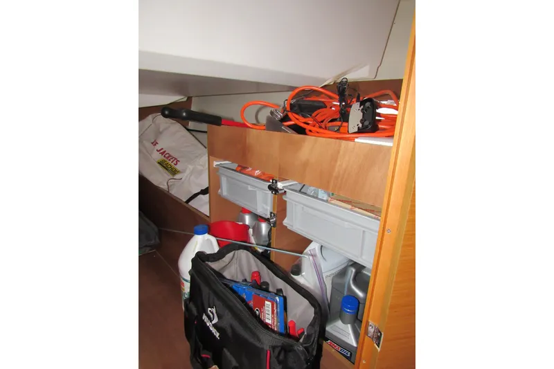 Slide: The Image of Storage area in a 2013 Jenneau Sun Odyssey 379 sailboat with tools and supplies. - 53
