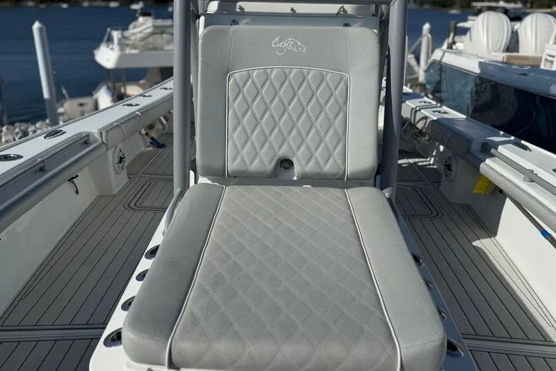 Slide: The Image of Costa Custom Boats 264 HC 2021 model with luxurious seating and diamond-pattern upholstery. - 10