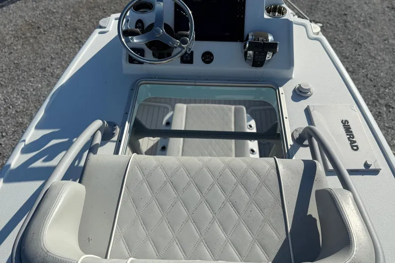 Slide: The Image of 2021 Costa Custom Boats 264 HC helm with steering wheel and Simrad electronics. - 20