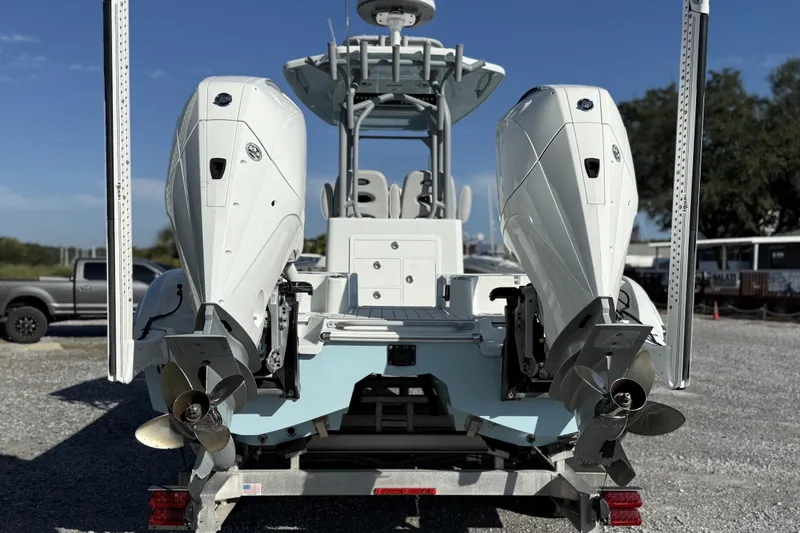 Slide: The Image of 2021 Costa Custom Boats 264 HC with dual outboard engines on trailer. - 4