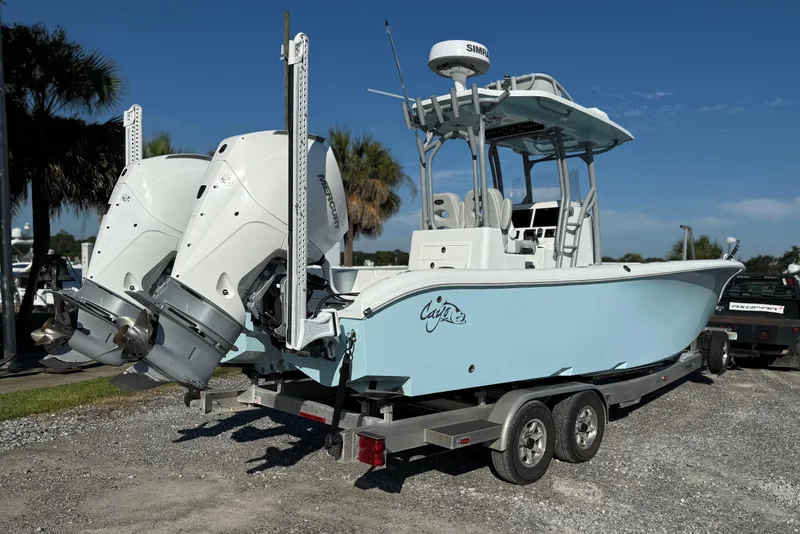 Slide: The Image of 2021 Costa Custom Boats 264 HC on trailer, featuring dual Mercury engines. - 5