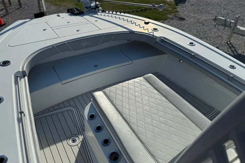 Slide: The Image of 2021 Costa Custom Boats 264 HC interior with cushioned seating and sleek design. - 8