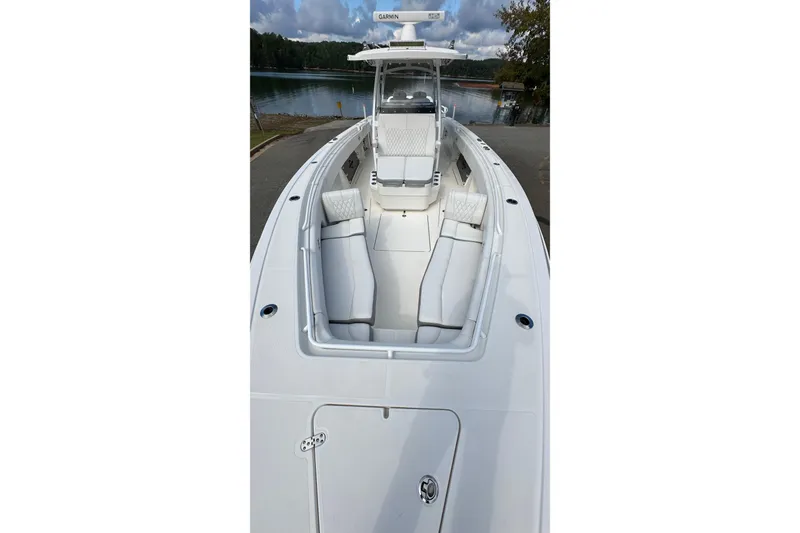 Slide: The Image of 2022 Fountain 38 CC LS boat with sleek white seating and modern design. - 11