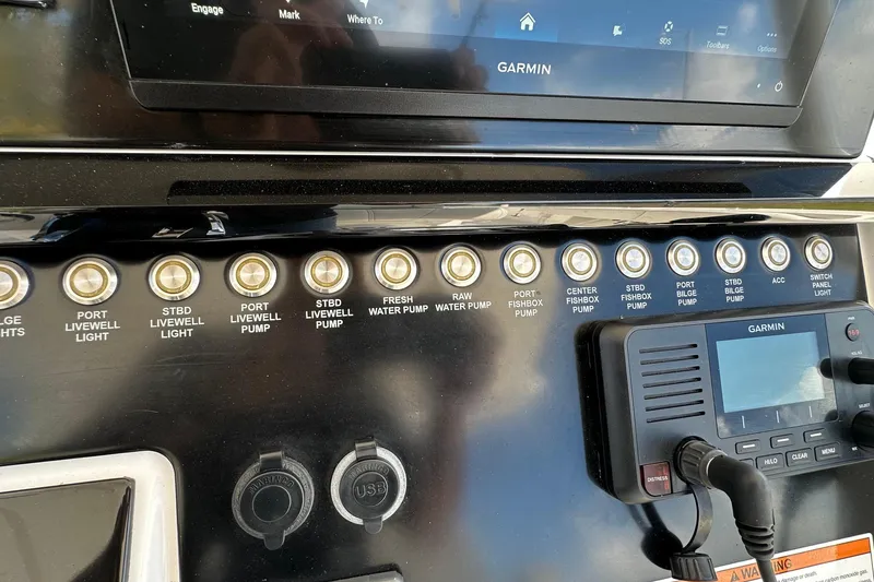 Slide: The Image of Control panel of a 2022 Fountain 38 CC LS boat with Garmin navigation system. - 26