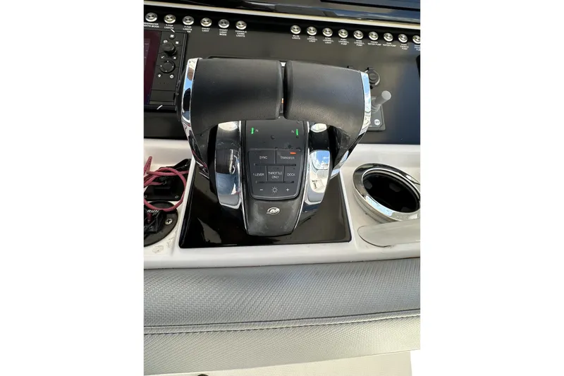 Slide: The Image of 2022 Fountain 38 CC LS boat throttle controls with modern dashboard interface. - 27