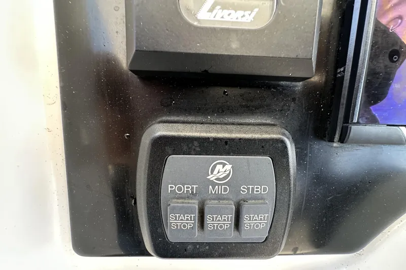 Slide: The Image of Control panel of 2022 Fountain 38 CC LS boat with start/stop buttons. - 30