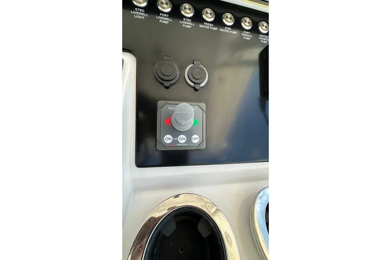 Slide: The Image of Control panel of 2022 Fountain 38 CC LS boat with switches and joystick. - 31