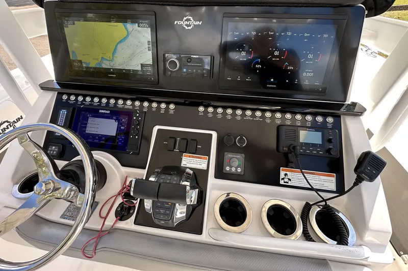 Slide: The Image of 2022 Fountain 38 CC LS boat dashboard with advanced navigation and control systems. - 33