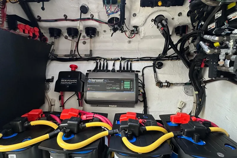 Slide: The Image of Electrical system of a 2022 Fountain 38 CC LS boat, featuring batteries and wiring. - 35