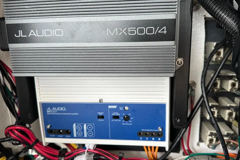 Slide: The Image of JL Audio amplifiers in 2022 Fountain 38 CC LS boat, showcasing marine audio setup. - 36