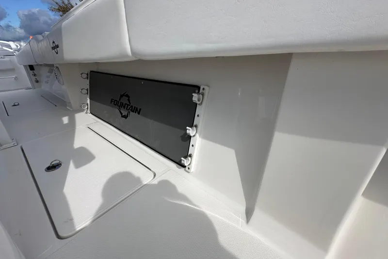 Slide: The Image of 2022 Fountain 38 CC LS boat interior with branded storage compartment. - 48