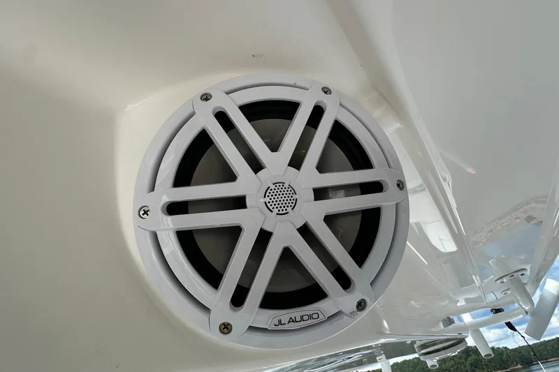 Slide: The Image of JL Audio speaker on 2022 Fountain 38 CC LS boat, white exterior. - 52