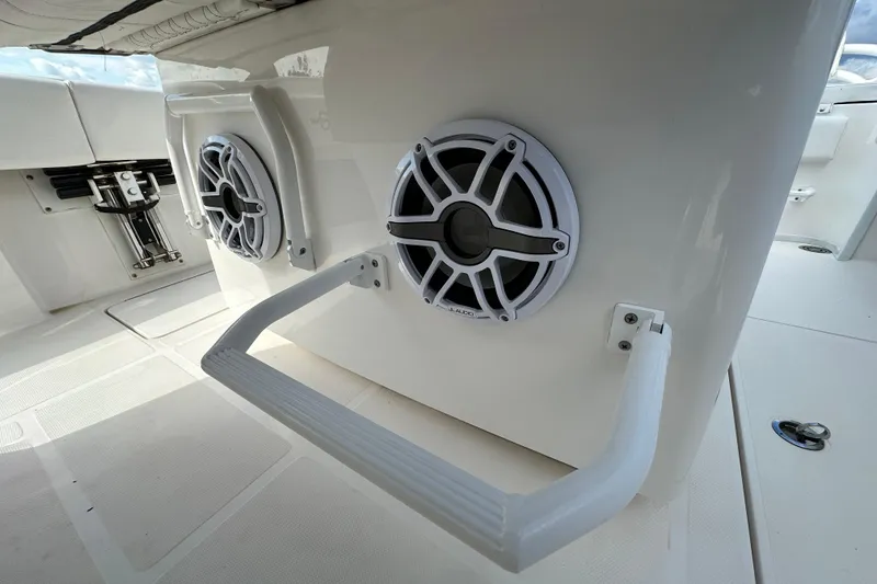 Slide: The Image of 2022 Fountain 38 CC LS boat speakers and handrails on deck. - 53