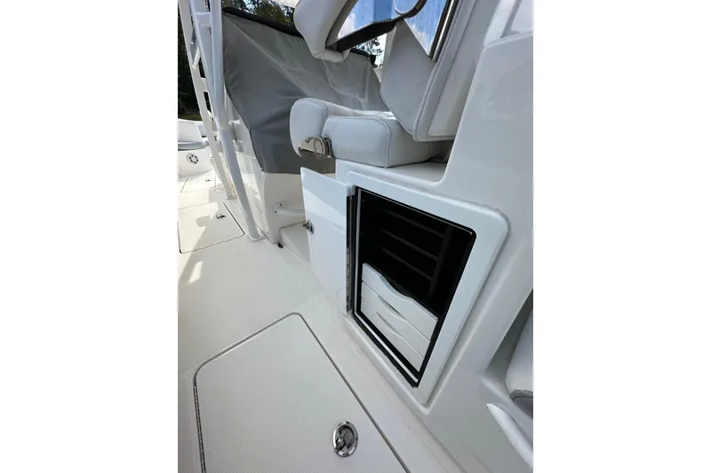 Slide: The Image of 2022 Fountain 38 CC LS boat interior with seating and storage compartments. - 55