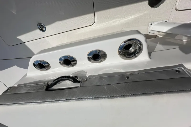Slide: The Image of 2022 Fountain 38 CC LS boat detail with rod holders and storage compartment. - 56