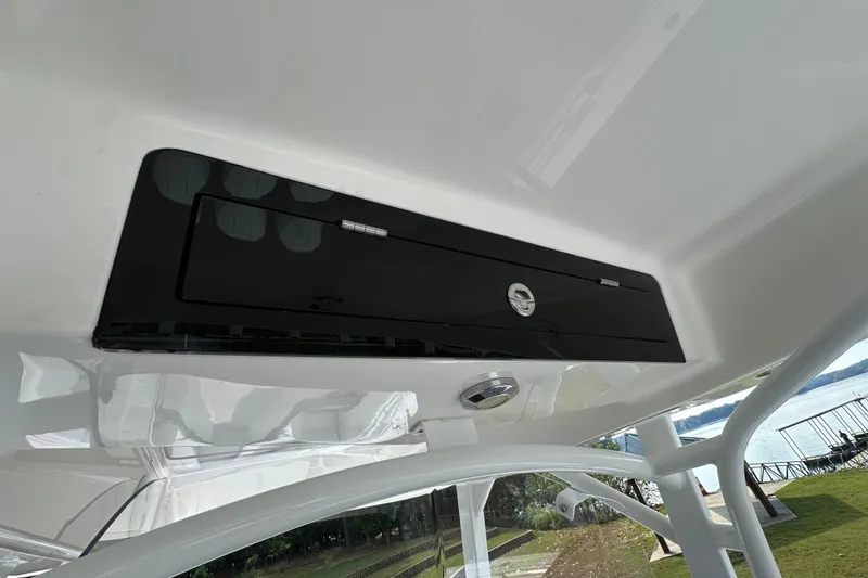 Slide: The Image of 2022 Fountain 38 CC LS boat interior detail with black storage compartment. - 57