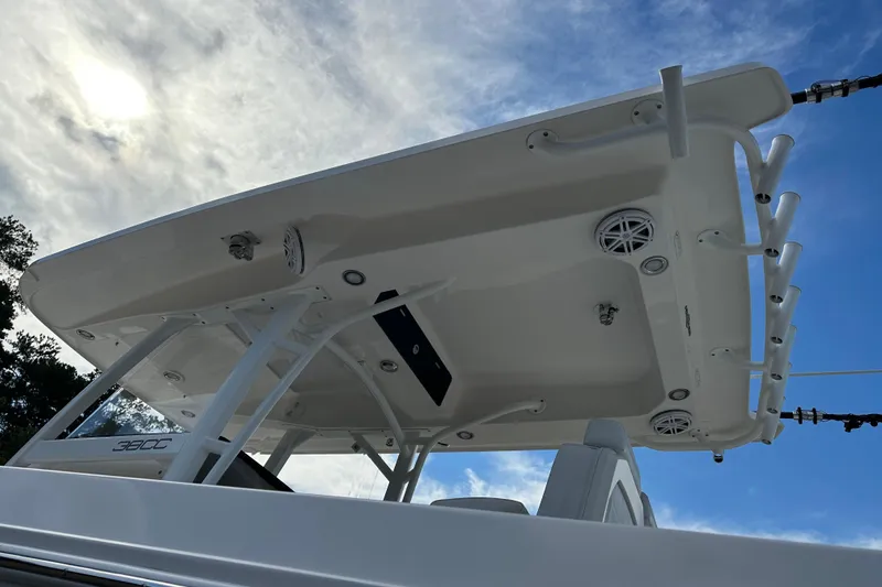 Slide: The Image of 2022 Fountain 38 CC LS boat with T-top against a cloudy sky. - 62