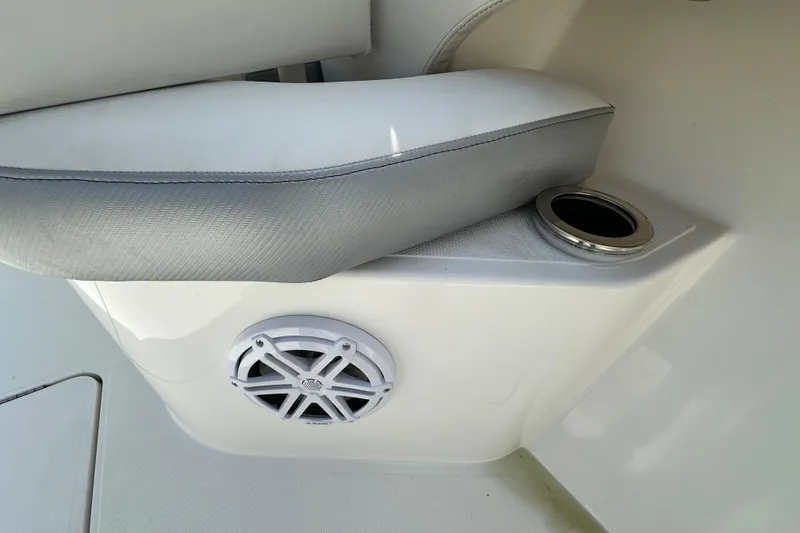 Slide: The Image of 2022 Fountain 38 CC LS boat interior with speaker and cup holder detail. - 63