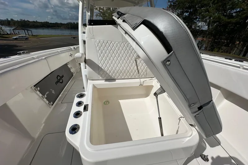 Slide: The Image of 2022 Fountain 38 CC LS boat with open storage compartment and quilted seating. - 65