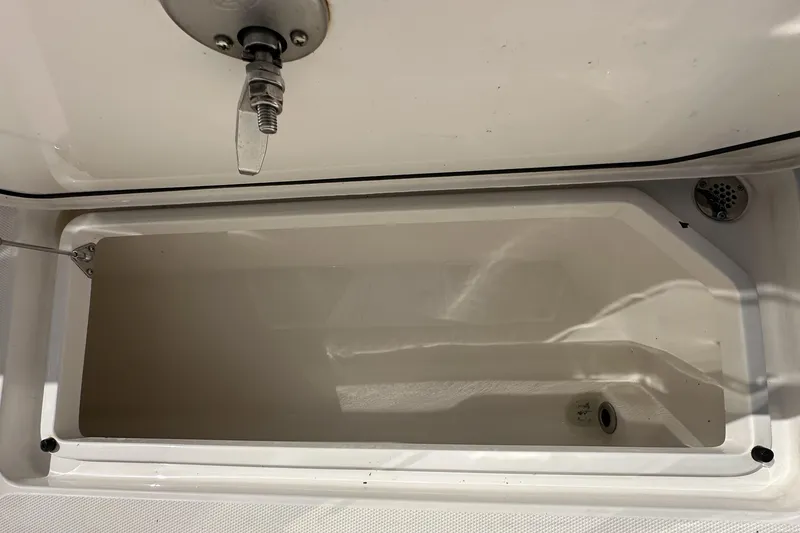 Slide: The Image of Open storage compartment on 2022 Fountain 38 CC LS boat. - 67
