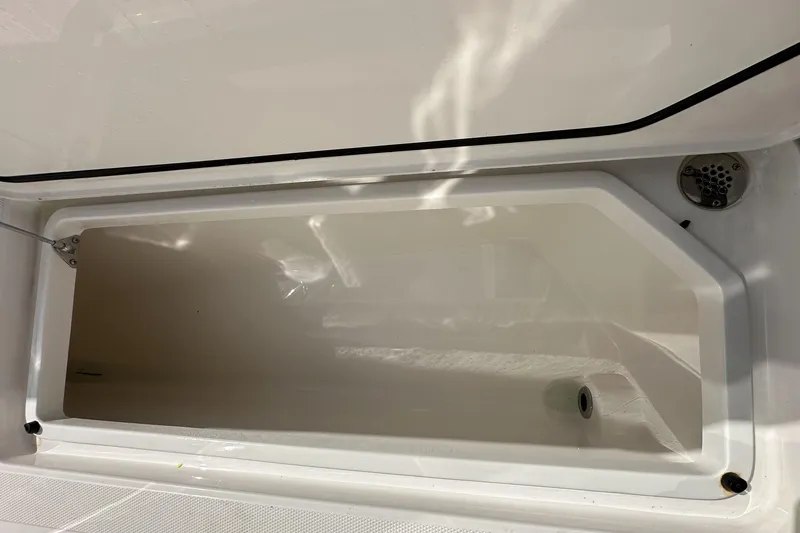 Slide: The Image of Open storage compartment on 2022 Fountain 38 CC LS boat. - 69