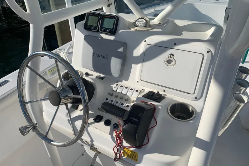 Slide: The Image of Center console of 2008 Everglades 223 boat with Garmin navigation and steering wheel. - 10