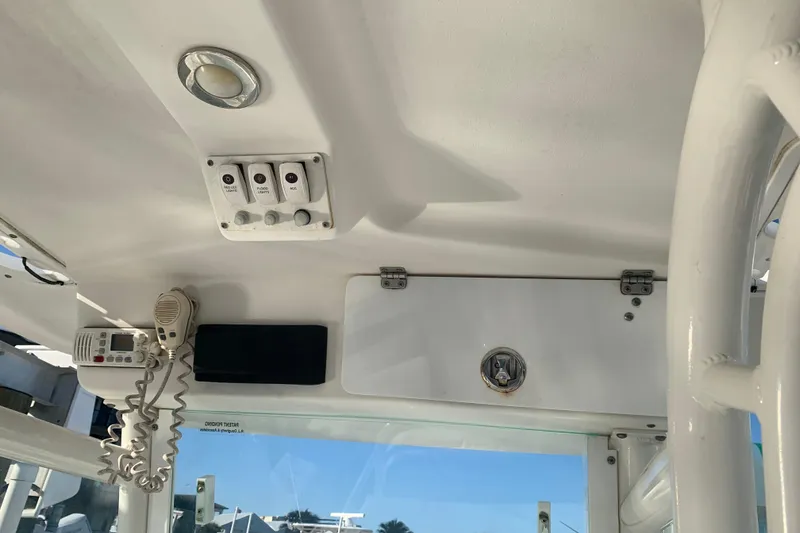 Slide: The Image of Interior view of 2008 Everglades 223 Center Console boat with control panel and radio. - 11