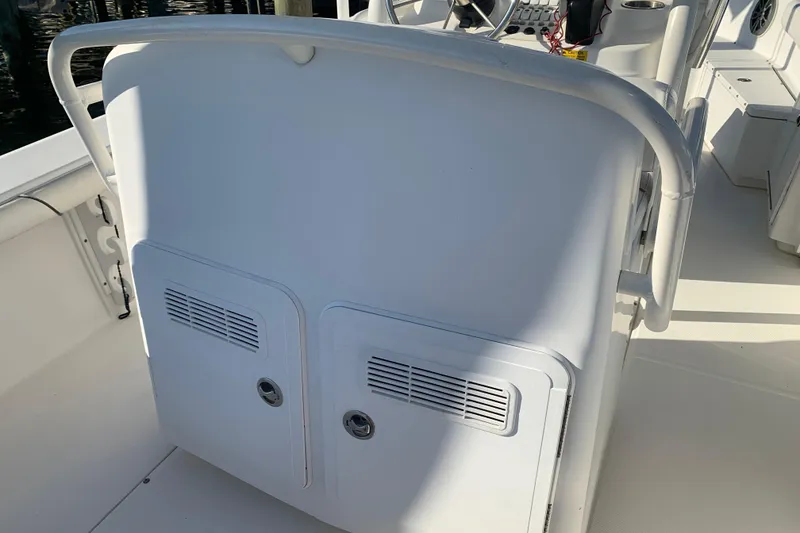 Slide: The Image of 2008 Everglades 223 Center Console boat interior with white console and seating. - 15
