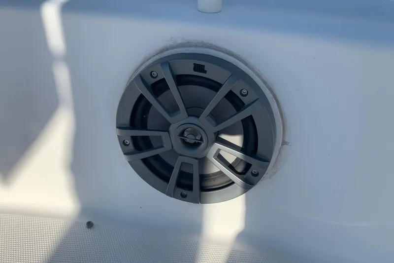 Slide: The Image of Speaker on 2008 Everglades 223 Center Console boat, mounted on white surface. - 23